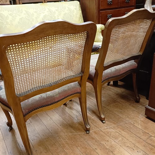 831 - A pair of gilt armchairs, with reeded backs, tapestry padded arms and seats and cabriole front legs ... 