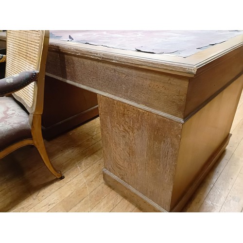 835 - A mahogany pedestal desk, having a nine drawer configuration, 153 cm wide