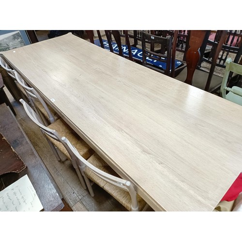 496 - ***Regretfully withdrawn***A limed oak dining table, the top 243 x 90 cm, and five matching chairs (... 