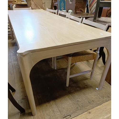 496 - ***Regretfully withdrawn***A limed oak dining table, the top 243 x 90 cm, and five matching chairs (... 