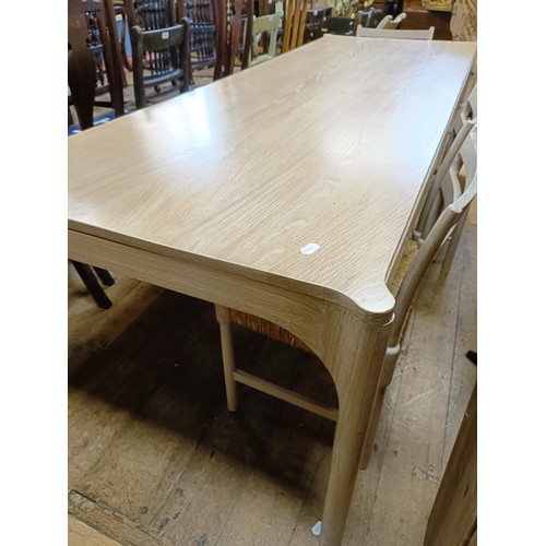 496 - ***Regretfully withdrawn***A limed oak dining table, the top 243 x 90 cm, and five matching chairs (... 