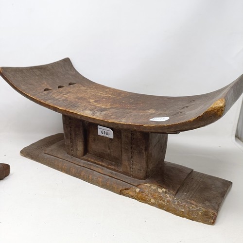 616 - An African carved stool, 49 cm wide, and a similar stand (2)