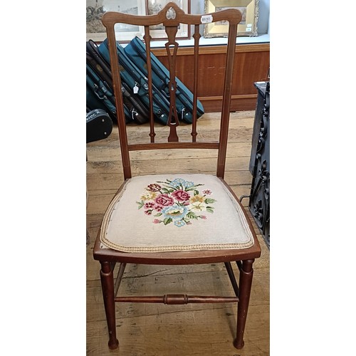 767 - A mahogany glazed bookcase, 82 cm wide, a teak trolley, and two chairs (4)