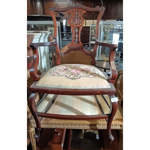 767 - A mahogany glazed bookcase, 82 cm wide, a teak trolley, and two chairs (4)