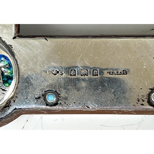 500 - An Archibald Knox Cymric silver and blue green enamel photograph frame, Liberty & Co, Birmingham... 