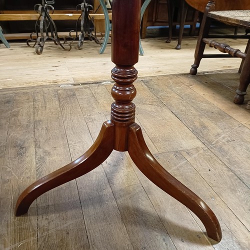 783 - A Victorian mahogany tripod table, 66 cm wide, and a George III style tripod table (2)