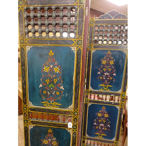 800 - A painted Moroccan four panel screen, each panel 186 x 45 cm