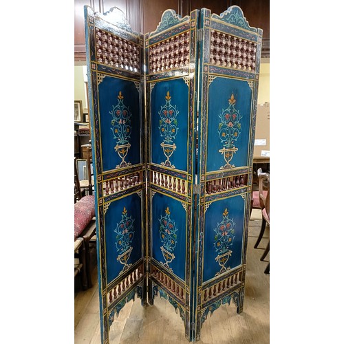 801 - A painted Moroccan four panel screen, each panel 187 x 45 cm