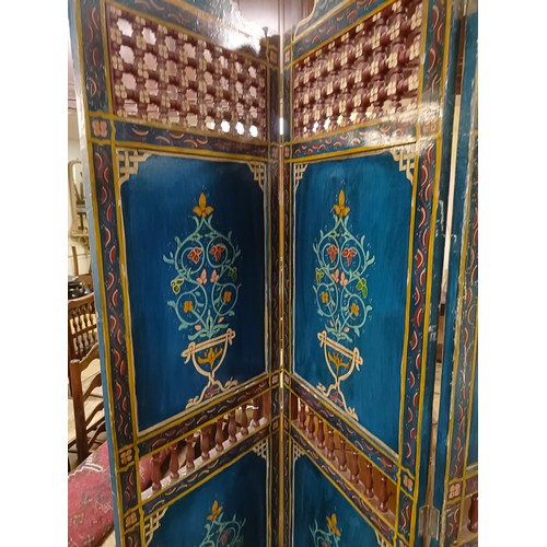 801 - A painted Moroccan four panel screen, each panel 187 x 45 cm