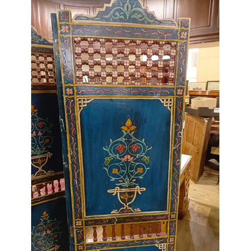 801 - A painted Moroccan four panel screen, each panel 187 x 45 cm