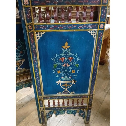 801 - A painted Moroccan four panel screen, each panel 187 x 45 cm