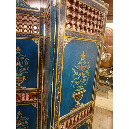 801 - A painted Moroccan four panel screen, each panel 187 x 45 cm