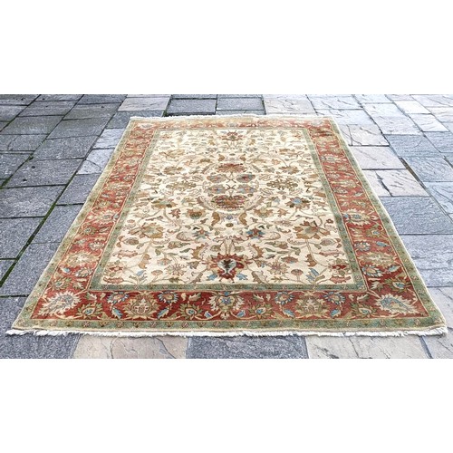 853 - A cream ground rug, 275 x 180 cm