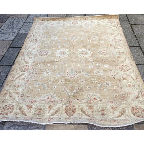 852 - A machine made cream ground carpet, 250 x 190 cm