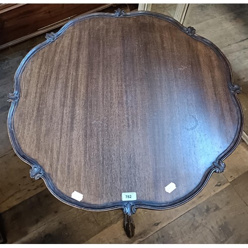 782 - A George III style mahogany tilt top tripod table, the base with a birdcage support, 80 cm diameter