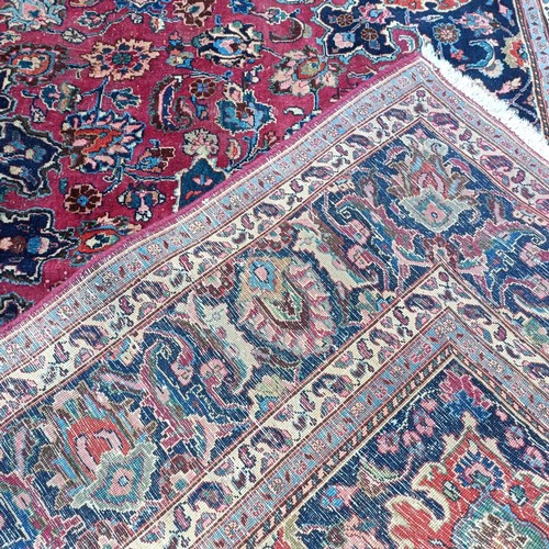 799 - A Persian type red ground carpet, 318 cm x 240 cm