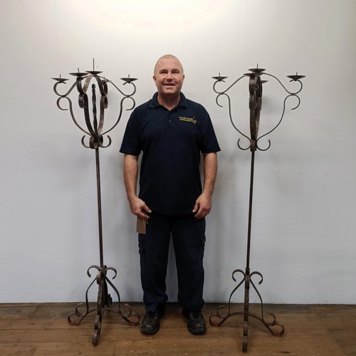 1171 - A pair of wrought iron standard pricket candle stands, 164 cm high (2)