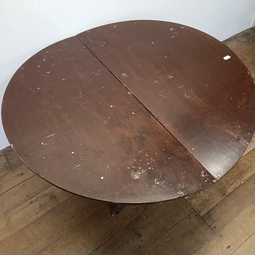 1207 - A walnut coaching folding demi-lune table, 105 cm wide