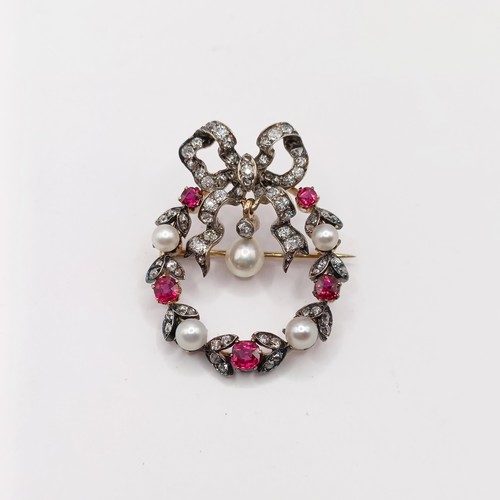 600 - A late 19th/early 20th century diamond, ruby and pearl pendant/brooch, with diamond pendant link, in... 