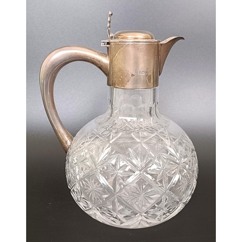 7 - An Edward VII cut glass claret jug, with silver mount and handle, Birmingham 1905, 18 cm high...