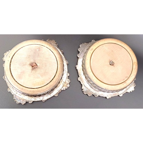 12 - A pair of Old Sheffield plate bottle coasters, with mahogany bases, 18 cm diameter (2)