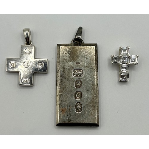 615 - A modern silver cross pendant, London 2000, a silver ingot pendant, London 1977, 2.2 ozt, a gold pla... 