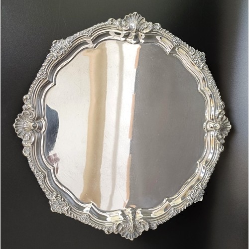 17 - A late Victorian silver salver, Sheffield 1899, 36.6 ozt, 33.5 cm diameter...