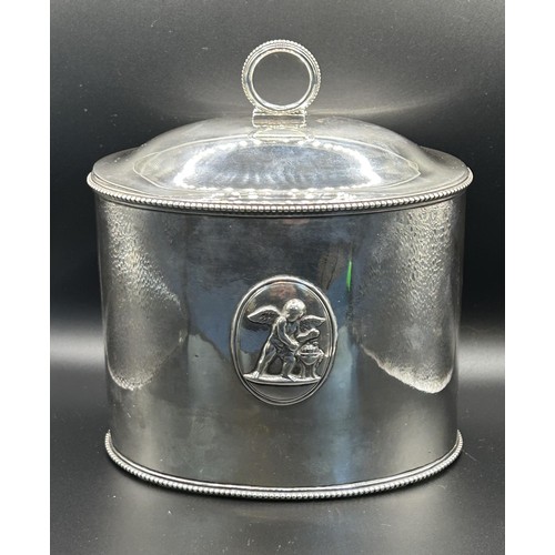 20 - A George III silver tea caddy, of oval form, decorated classical scenes, crested and inscribed, Lond... 