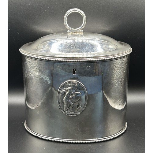 20 - A George III silver tea caddy, of oval form, decorated classical scenes, crested and inscribed, Lond... 