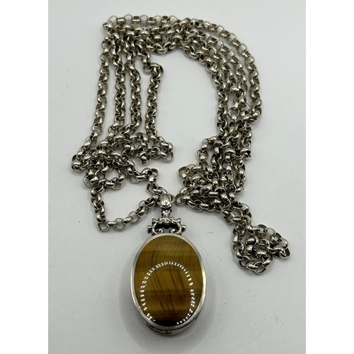 632 - An Elizabeth II silver, tiger's eye and Blue John pendant, London 1977, on a chain