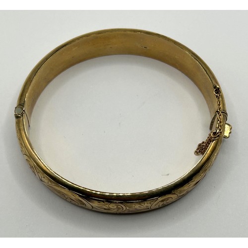 634 - A 9ct gold bangle, 14.8 g