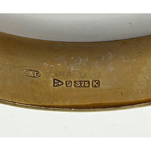 634 - A 9ct gold bangle, 14.8 g