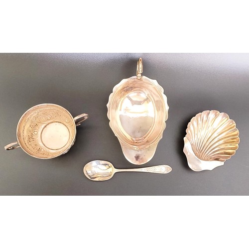 55 - A silver two handled cup, a sauce boat, a shell form dish, and a teaspoon, various dates and marks, ... 