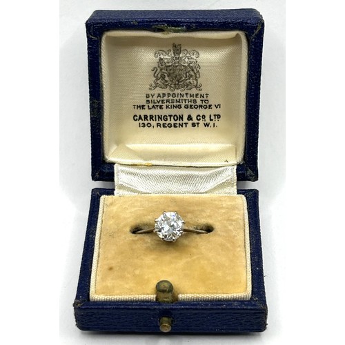 647 - An 18ct white gold and diamond solitaire ring, ring size N, in a vintage jewellery box, with a retai... 