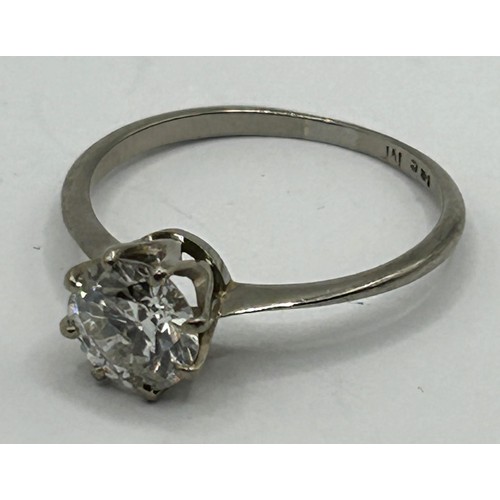 647 - An 18ct white gold and diamond solitaire ring, ring size N, in a vintage jewellery box, with a retai... 