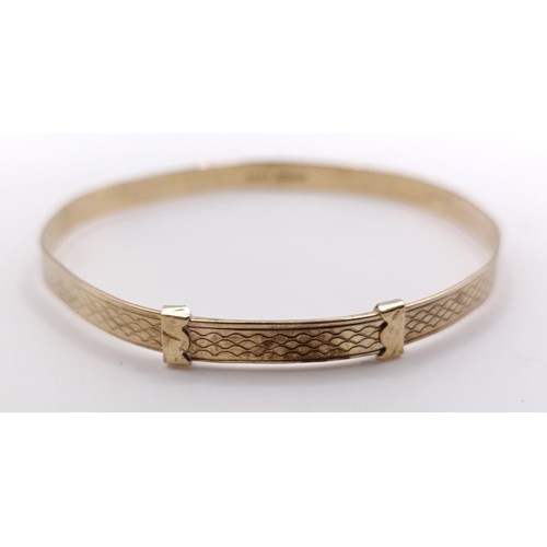 651 - A 9ct gold bangle, 5.5 g, and silver bangle (2)