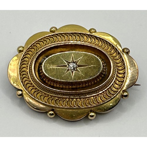 654 - A late 19th/early 20th century yellow metal and diamond memorial brooch