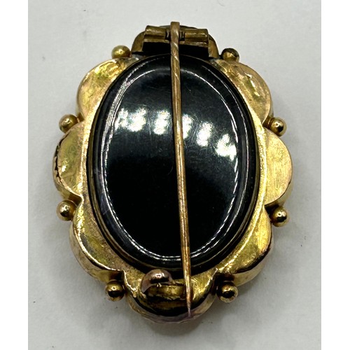 654 - A late 19th/early 20th century yellow metal and diamond memorial brooch