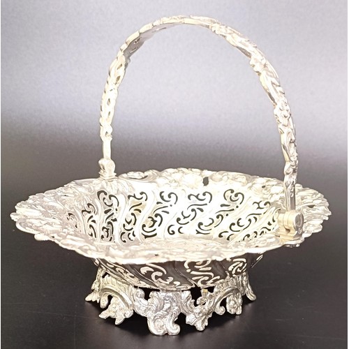 67 - A Victorian silver swing handle basket, embossed with floral and figural forms, London 1887, 5.9 ozt... 