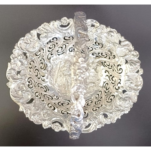 67 - A Victorian silver swing handle basket, embossed with floral and figural forms, London 1887, 5.9 ozt... 