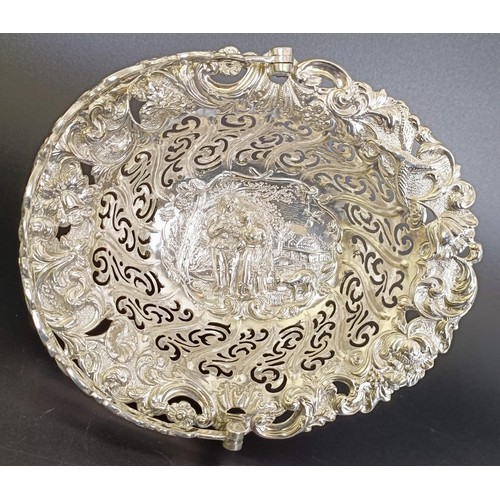 67 - A Victorian silver swing handle basket, embossed with floral and figural forms, London 1887, 5.9 ozt... 