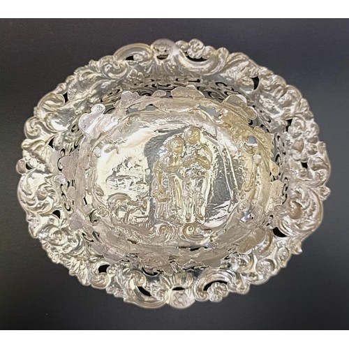 67 - A Victorian silver swing handle basket, embossed with floral and figural forms, London 1887, 5.9 ozt... 