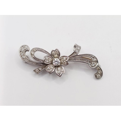 658 - A white gold and diamond flowerhead brooch