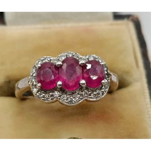 659 - An 18ct gold, ruby and diamond ring, ring size E