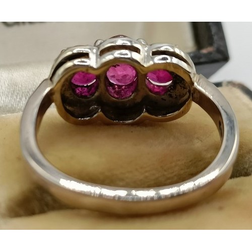 659 - An 18ct gold, ruby and diamond ring, ring size E