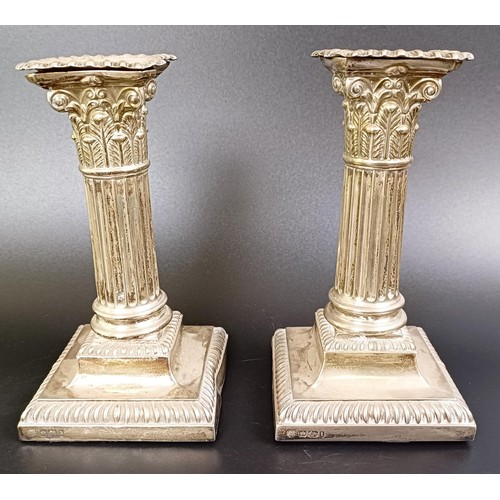 74 - A pair of late Victorian silver squat candlesticks, in the form of Corinthian columns, Sheffield 190... 