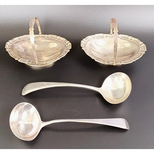 77 - A silver Old English pattern sauce ladle, another, and a pair of swing handle baskets, various dates... 