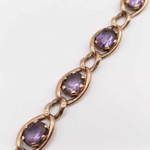 673 - A 9ct gold and paste braceletNOTE change of description not Amethyst