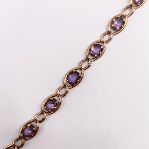 673 - A 9ct gold and paste braceletNOTE change of description not Amethyst