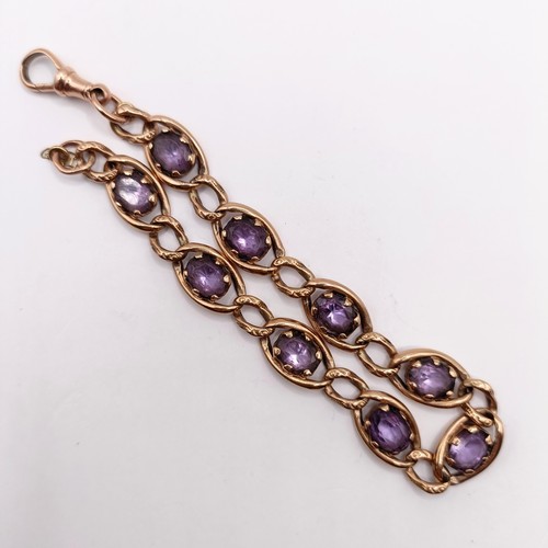 673 - A 9ct gold and paste braceletNOTE change of description not Amethyst